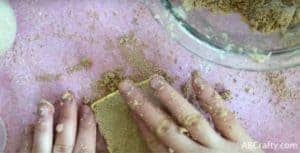 Pressing mixture into chocolate bar mold