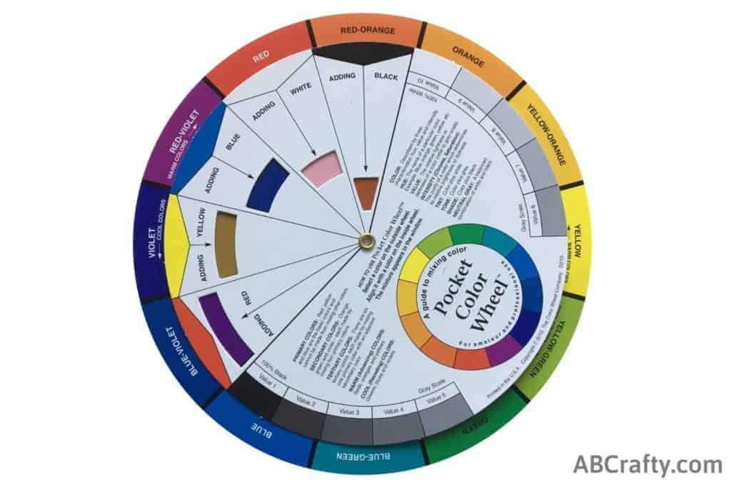 color wheel showing adding black to red-orange to make brown