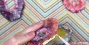 painting gold edible glitter onto candy pink agate slice