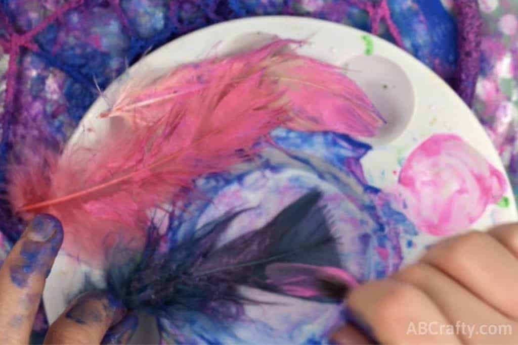 Painting feathers in galaxy colors