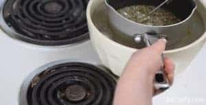 putting a pot of boiling candy into a bowl of water and ice