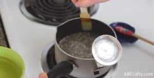 wiping down the sides of the pot with a pastry brush and water