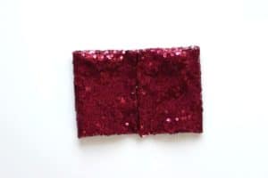 Red sequin fabric folded into a rectangle