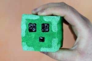 Holding finished DIY squishy in the shape of a Minecraft slime block