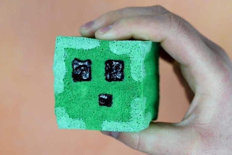 Holding finished DIY squishy in the shape of a Minecraft slime block