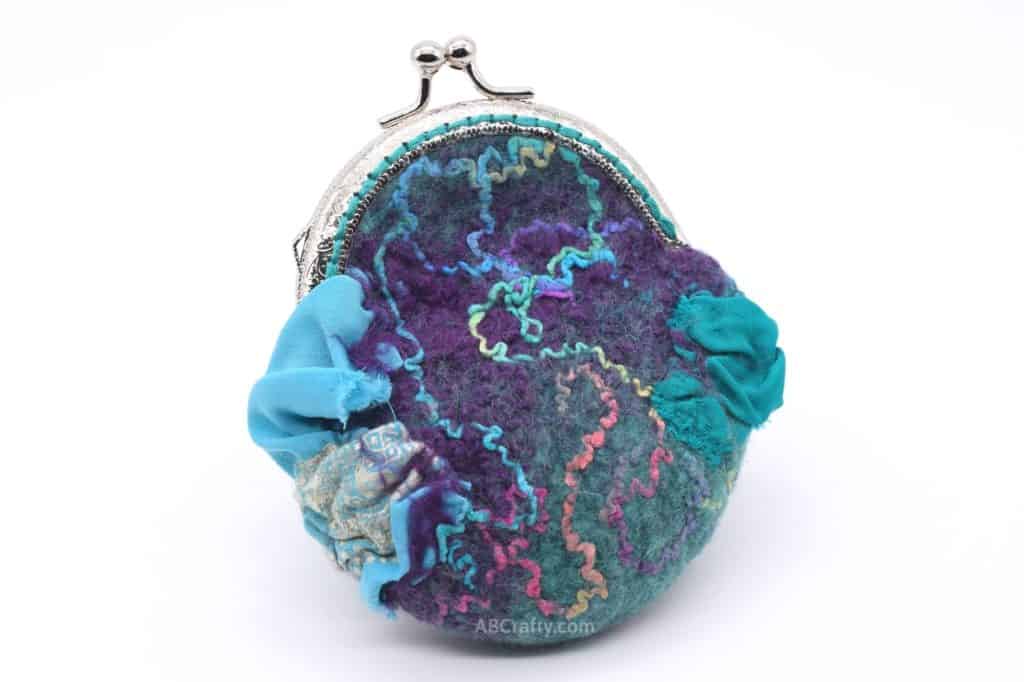 Other side of handmade felted coin purse made of wool with silver coin purse clasp