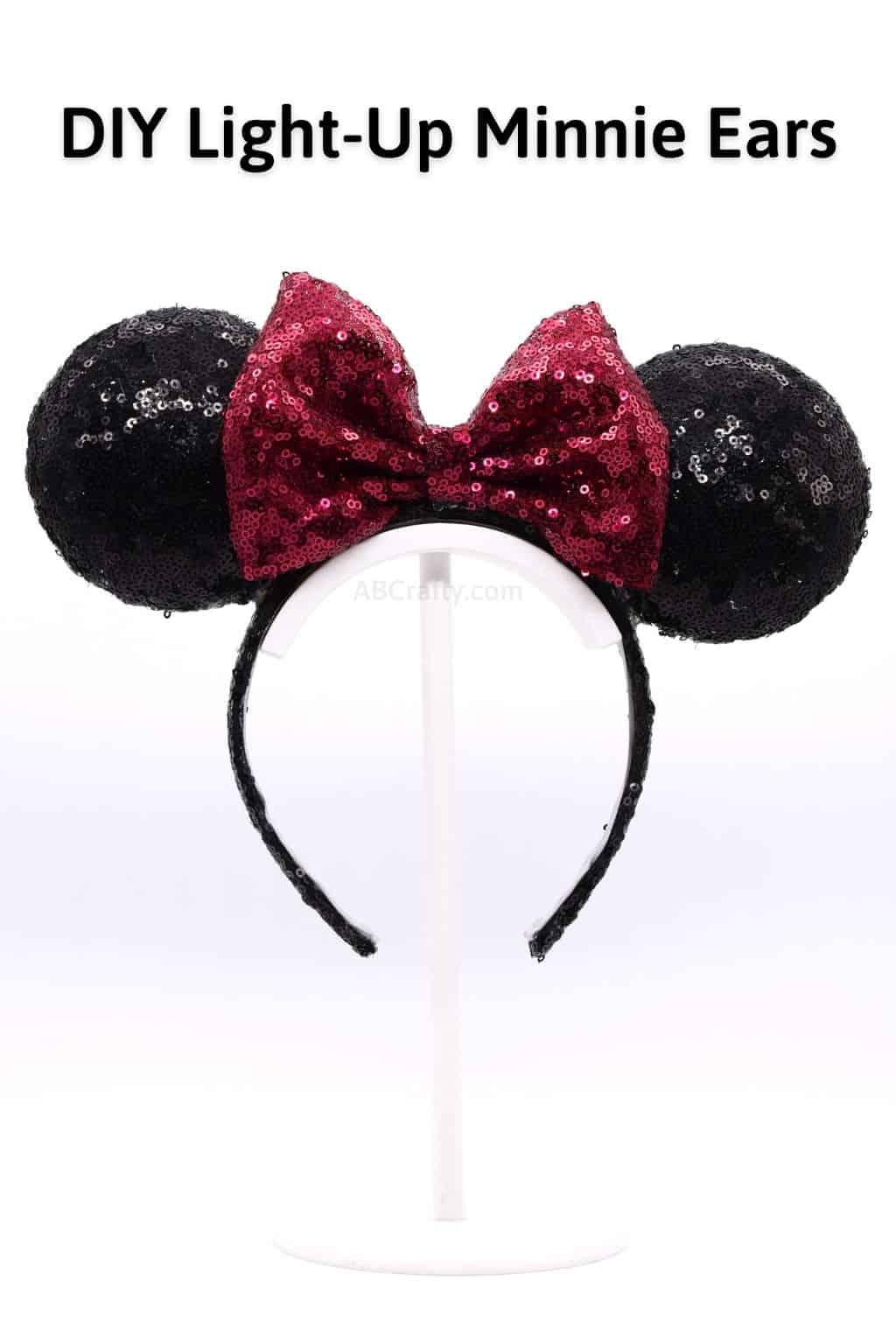 Titled DIY Classic Light Up Minnie Ears. It's a black sequined headband with a red sequined bow, creating the classic Disney Minnie Mouse ears