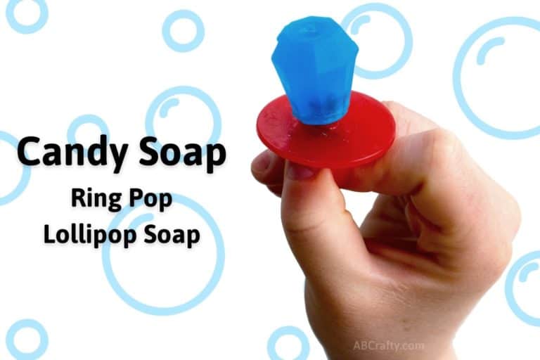 Holding blue candy soap in the shape of a ring pop with the title "Candy Soap Ring Pop Lollipop Soap"