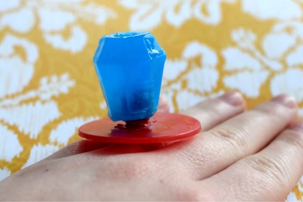 Wearing a blue ring pop soap on a hand