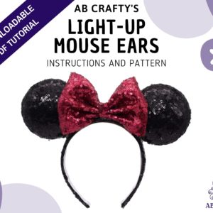 Cover image of "ab crafty's" light-up mouse ears, instructions and pattern" with a finished minnie mouse headband in the middle and the ab crafty octopus logo in the bottom. A banner across the top left corner reads "downloadable pdf tutorial