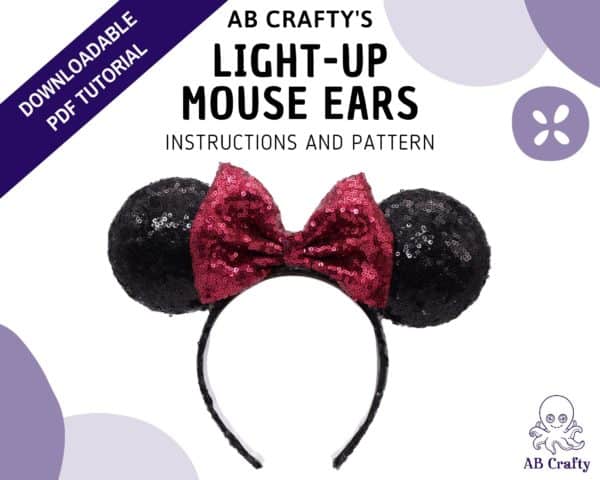 Cover image of "ab crafty's" light-up mouse ears, instructions and pattern" with a finished minnie mouse headband in the middle and the ab crafty octopus logo in the bottom. A banner across the top left corner reads "downloadable pdf tutorial