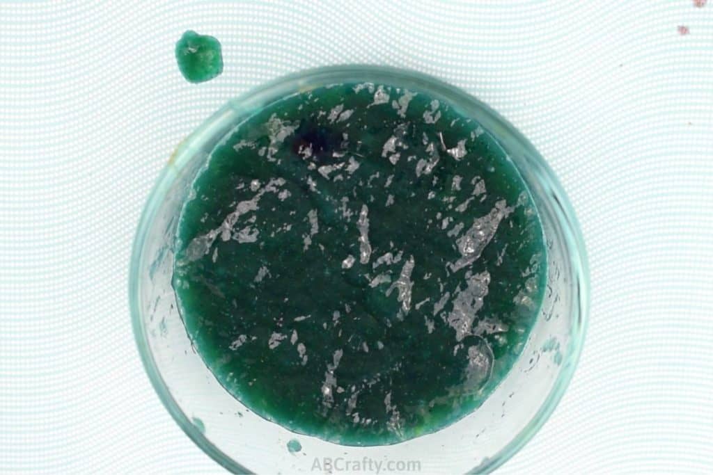 greenish blue slime in a glass bowl