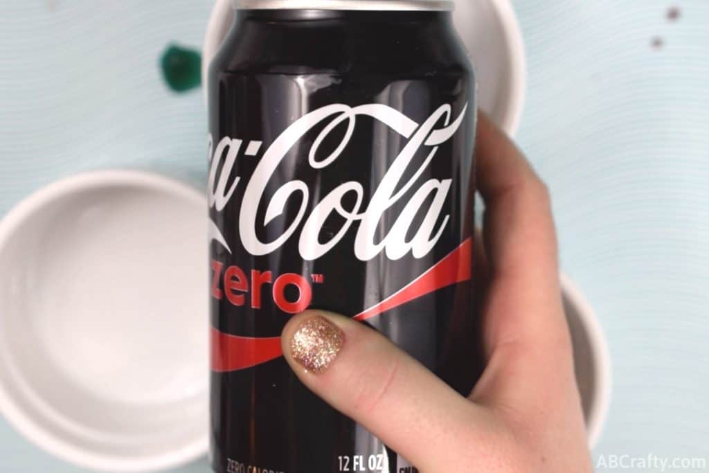 holding a coke zero