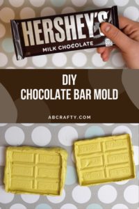 the image on top is a hand holding a hershey's milk chocolate bar and the bottom image is two homemade silicone chocolate bar molds with the title 'diy chocolate bar mold, abcrafty.com'