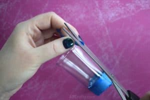 Cutting the end of blue vinyl tape at an angle