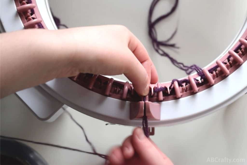 placing the yarn through the yarn holder of the sentro knitting machine