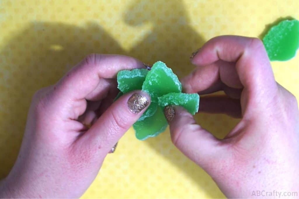 assembling multiple sections of the candy succulent made of green mint gummies