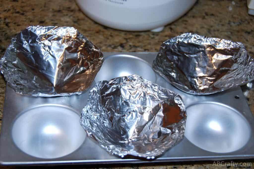 cones made of tin foil inside a cupcake tin