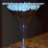photo of a martini cupcake, which is a chocolate cupcake with green frosting in a martini glass