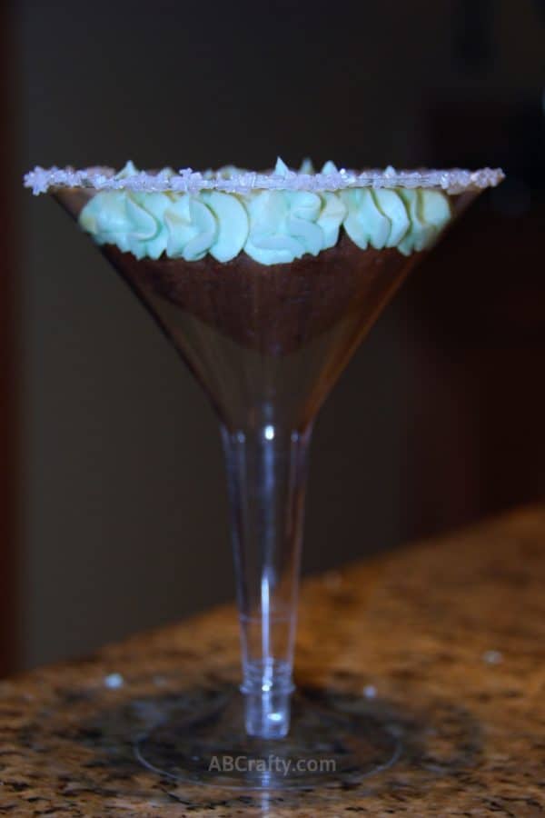 photo of a martini cupcake, which is a chocolate cupcake with green frosting in a martini glass