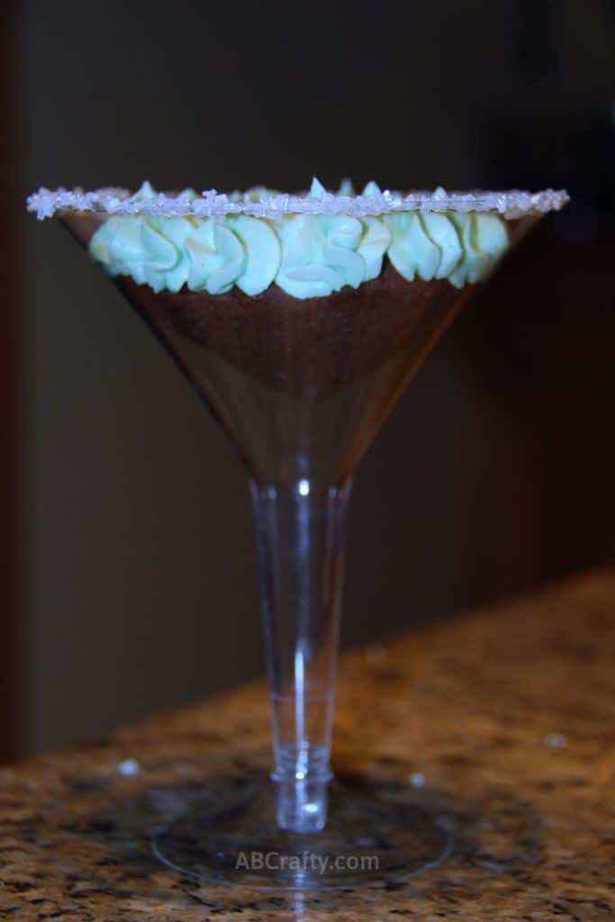 photo of a martini cupcake, which is a chocolate cupcake with green frosting in a martini glass