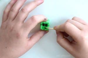 adding the face to minecraft eraser in the shape of a slime block