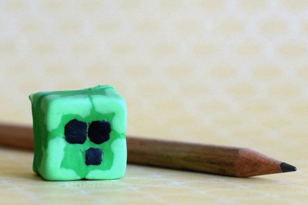 finished homemade slime block minecraft eraser made from creatibles diy eraser kit next to a pencil