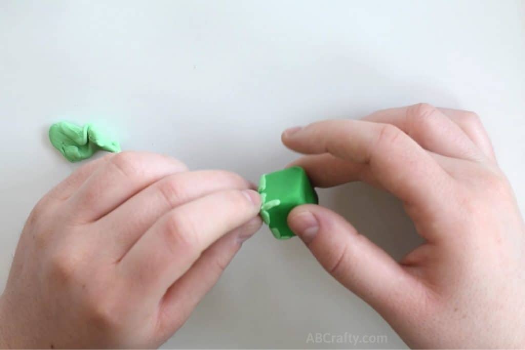 adding a small stripe of light green clay to a cube