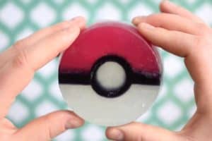 holding a homemade pokeball soap with two hands
