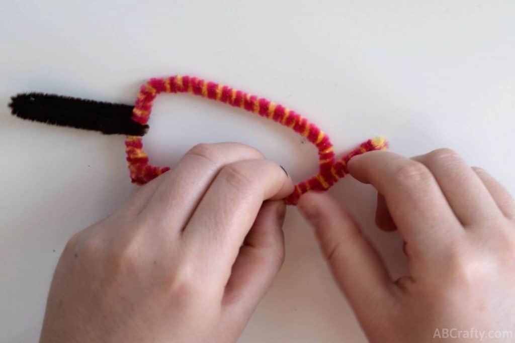 forming the shape of a popsicle with a pipe cleaner