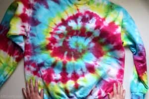 showing the bottom of a rainbow tie dye sweatshirt to show the tie dye spiral