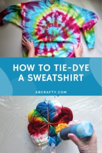 one image touching a rainbow tie dye sweatshirt with the bottom image pouring blue dye on a partially tie dyed sweatshirt with the title "how to tie-dye a sweatshirt"