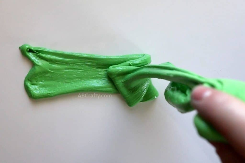 letting green goo fold over itself by letting it drop from holding it above a table