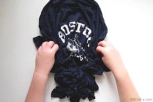 scrunching a navy boston shirt