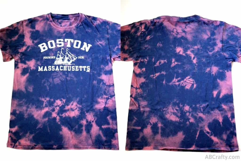 a bleach tie dye navy boston t shirt with pink splotches from scrunching