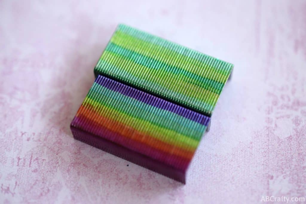 rainbow and green colored staples next to each other