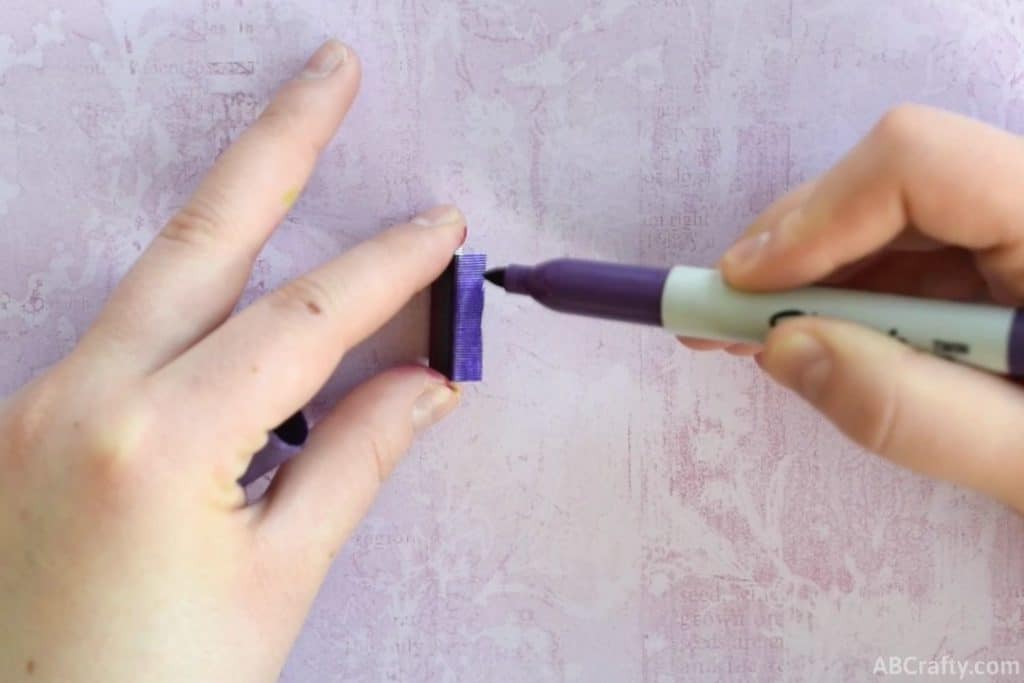 coloring the side with a purple sharpie