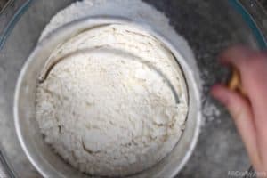 sifting flour and dry ingredients in a sifter