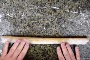 rolling cookie dough into a log