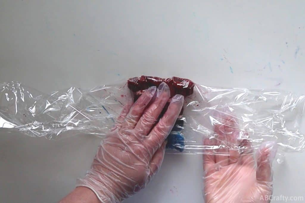 wrapping plastic around dyed articles of clothing