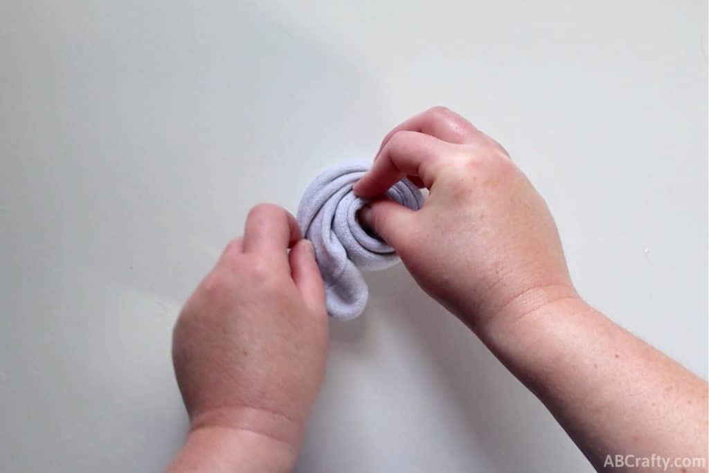 wrapping a white sock into a spiral