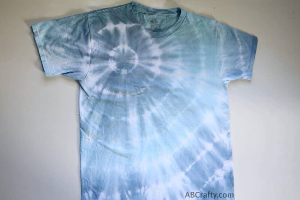 finished corner bullseye shibori tie dye shirt in shades of blue and indigo