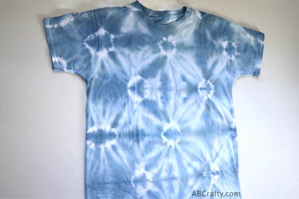 finished shibori tie dye shirt with small bursts of circles