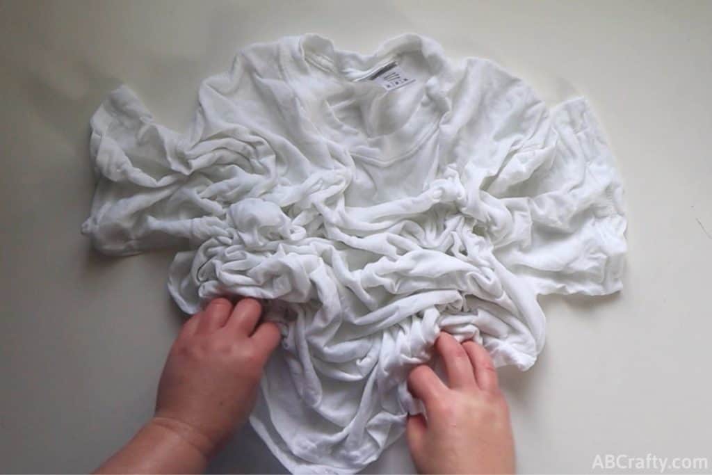 scrunching a white t shirt
