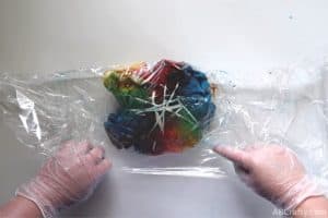 wrapping a just tie dyed shirt in plastic wrap