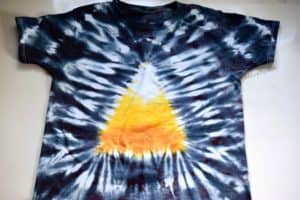finished candy corn tie dye shirt with candy corn design in the middle and black around the edge