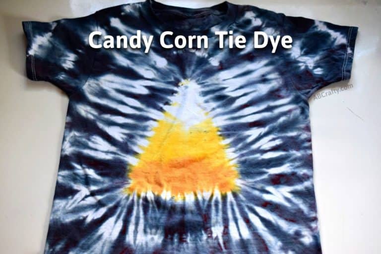 finished candy corn tie dye t shirt with candy corn design in the middle and black around the edge and the title "candy corn tie dye"