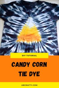 finished candy corn tie dye t shirt with candy corn design in the middle and black around the edge and the title "diy tutorial - candy corn tie dye"