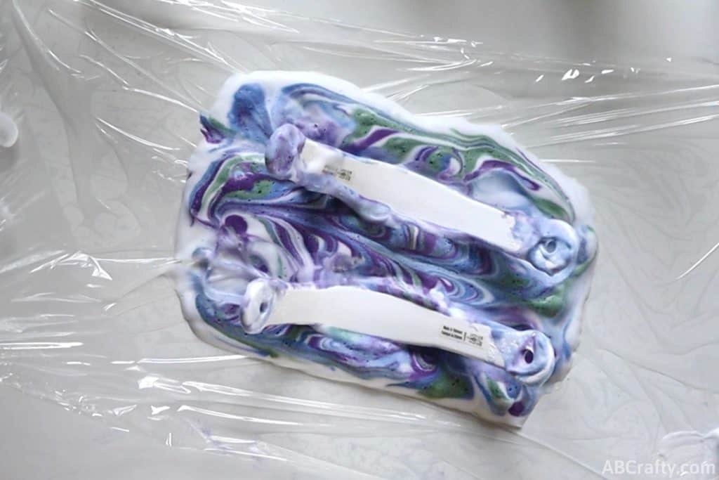 both croc straps in a rectangle of shaving cream and dye
