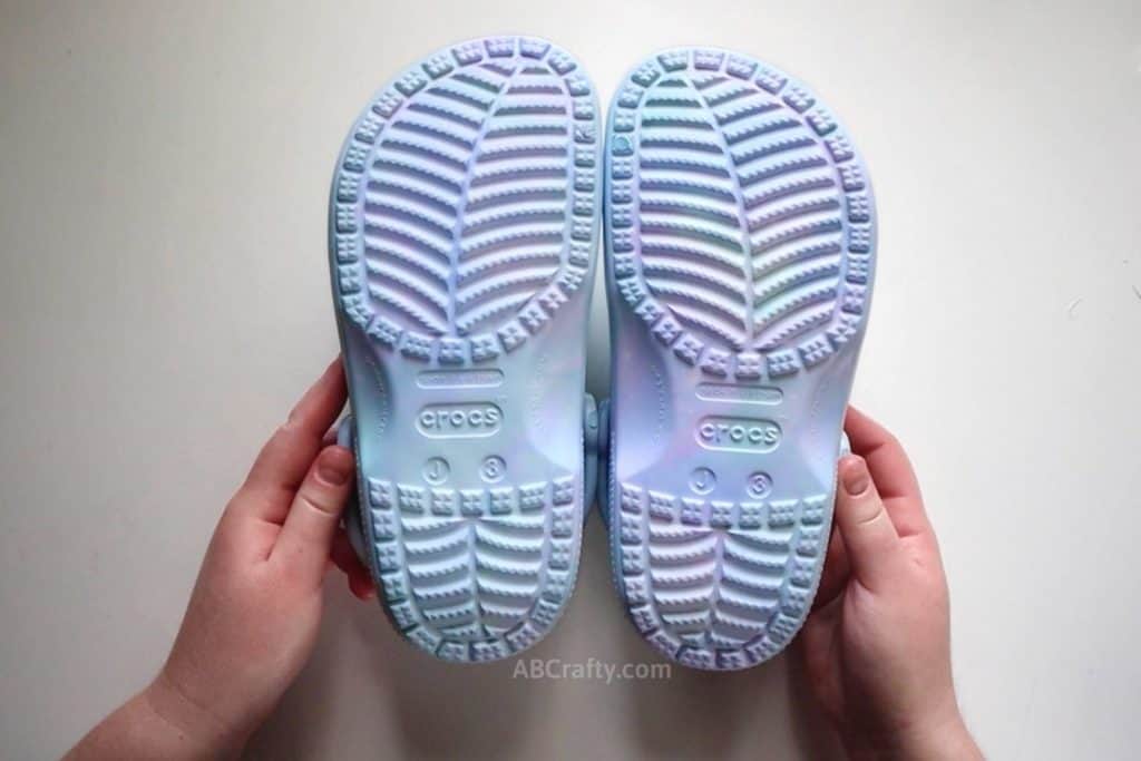 showing the bottom of the blue, purple, and green tie dye croc